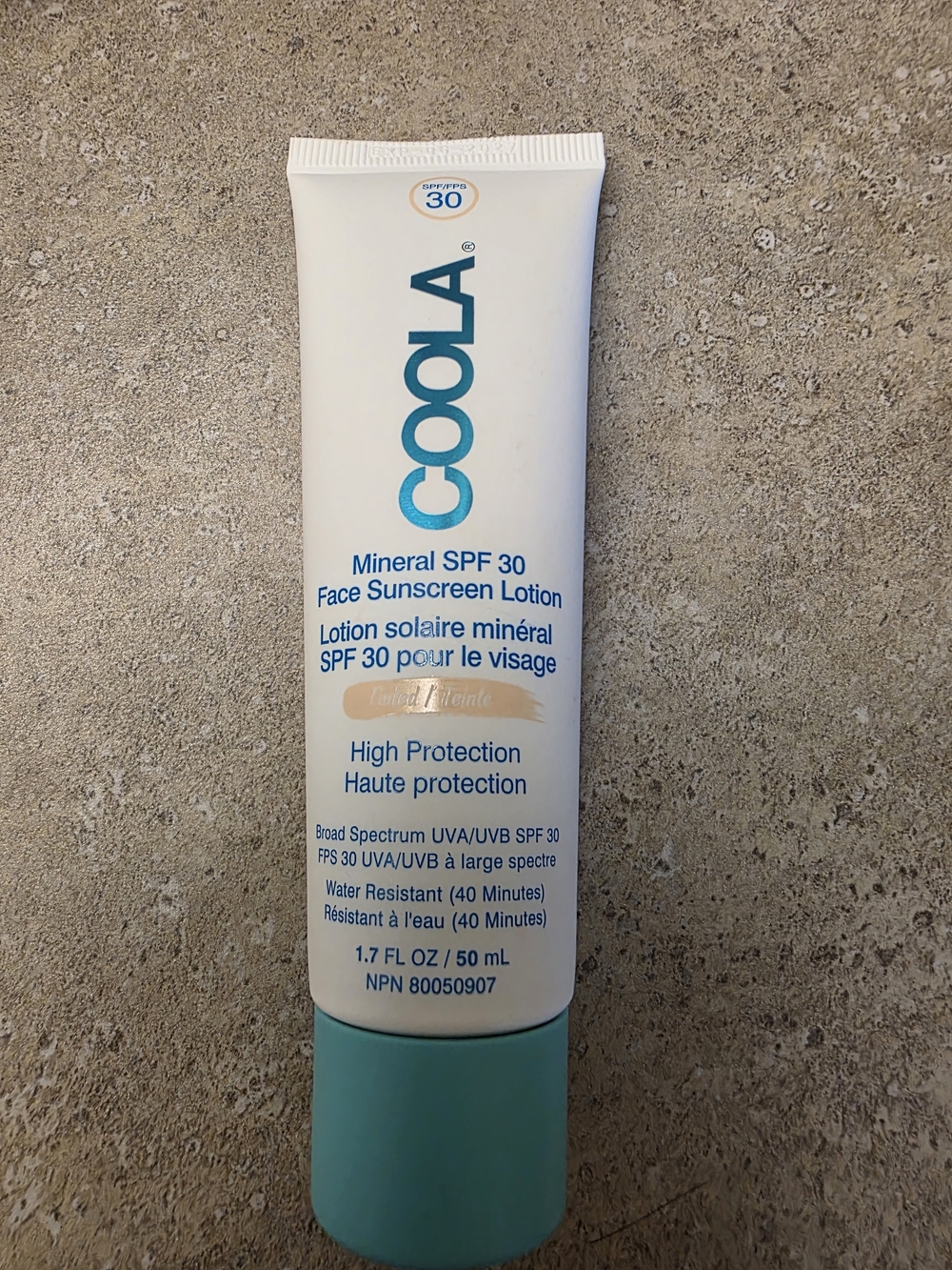 COOLA Face Sunscreen Lotion in White and Teal